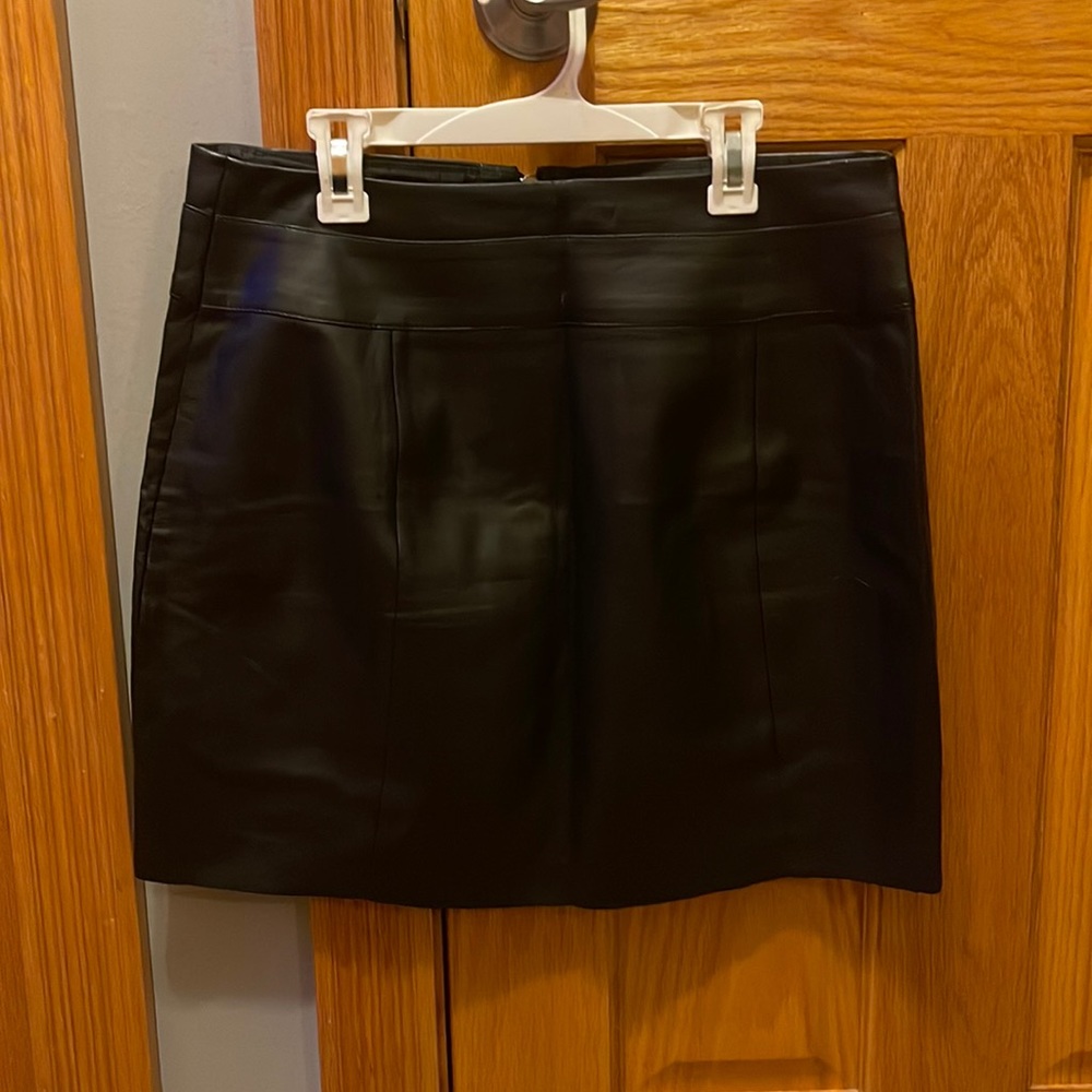 Leather black mini skirt.